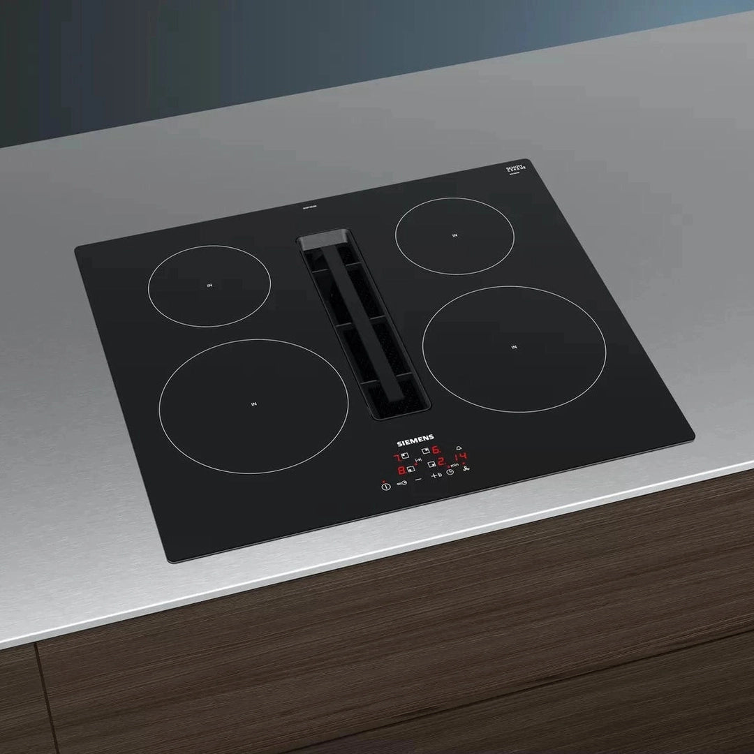 Siemens iQ300 EH611BE15E induction hob, angled view on a steel worktop