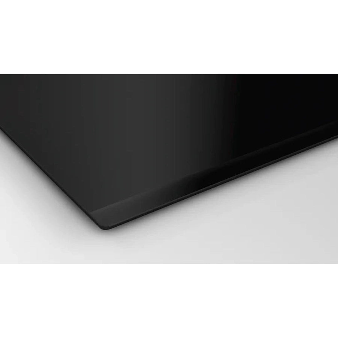 Bosch Series 4 PIE631BB5E induction hob, close-up of the glass corner